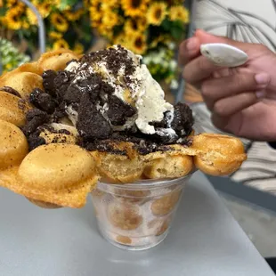 n ice cream sundae with cookies and whipped cream