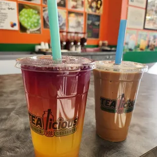 My lychee passion fruit lemonade with cantaloupe bursting boba (left) and his coffee milk tea.