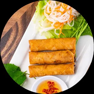 a plate of fried spring rolls