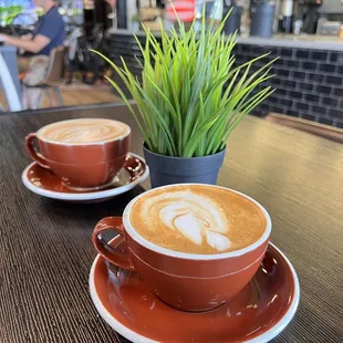 two cups of coffee on a table
