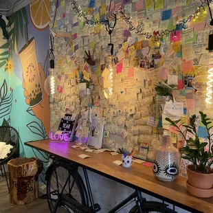 a table with plants and notes on it