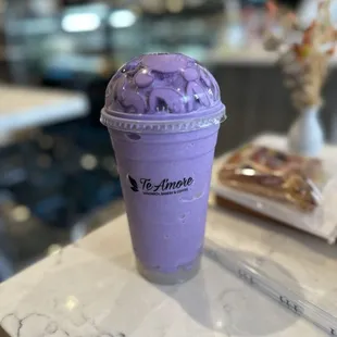 a purple drink on a table