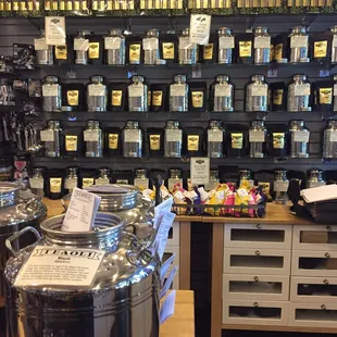 a display of teas and teapots in a store