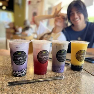 Ube latte, strawberry tea, taro milk tea, and mango slushy.