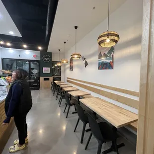 a woman standing in the middle of the room