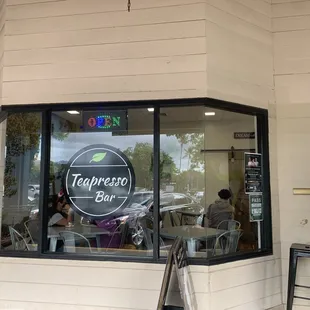 a woman taking a picture of her phone