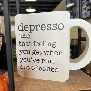 a cup of coffee on a shelf
