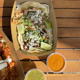 top: chicken taco; bottom: tofu taco; green &amp; orange sauce