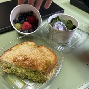 Chicken pesto sandwich ,fruit cup, spinach salad w/ raspberry vinaigrette.