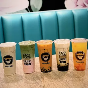 a row of different drinks on a table