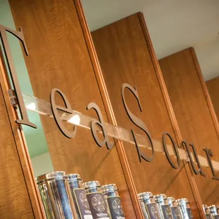 a row of teas on a shelf