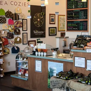 a coffee shop counter with a variety of items