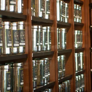 a shelf of teas in a tea shop