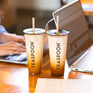 two cups of tea and a laptop