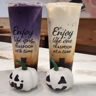 two cups of iced coffee on a table