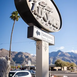 a sign for a hotel in the desert