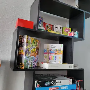 a shelf of games
