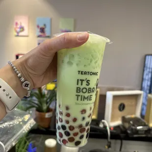 Honeydew milk tea with rainbow boba( black, golden, and pink color boba)