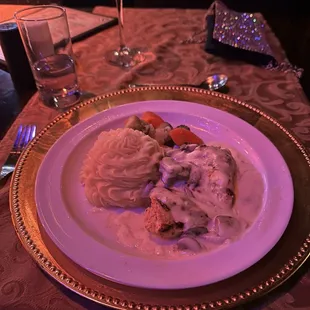 Chicken, mashed potatoes, and mixed vegetables.