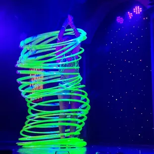 a woman standing on a spiral table