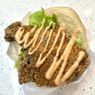 Customer favorite - Fried Chicken Bao. Steam and Fried fresh to order.
