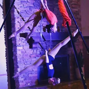Our aerialists offer lyra, silks, and aerial hammock with a free standing, portable aerial rig that extends to 7ft, 14ft, or 21ft tall.