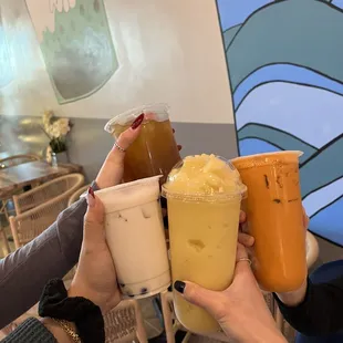 a group of people holding drinks