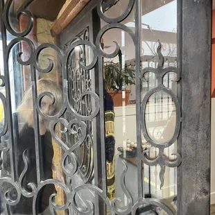 a woman looking through a glass door