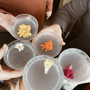 a group of people holding drinks