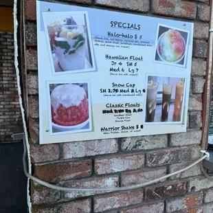 a menu on a brick wall
