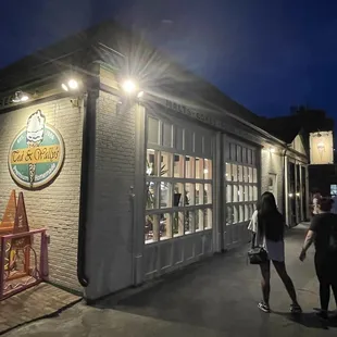 people walking in front of the store