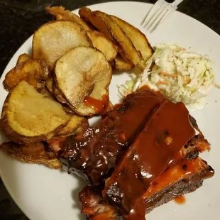 Quarter rack dinner with jojos and slaw. Takeout.