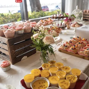 a table of cupcakes and pastries