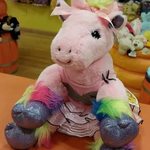 A colorful stuffed friend and a new outfit can brighten any day!