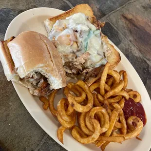 Chicken Philly Cheese Steak Sandwich and curly fries are delicious
