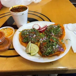 3 tacos with a small cup of consommé