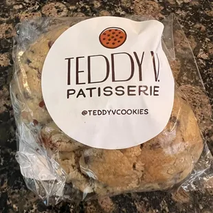 a chocolate chip cookie wrapped in plastic