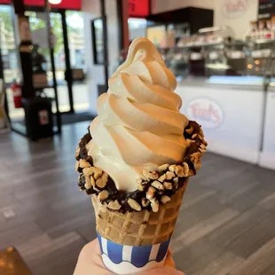 Vanilla soft serve in waffle cone