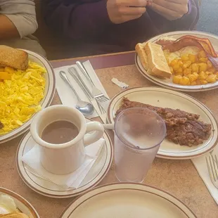 a table full of breakfast foods
