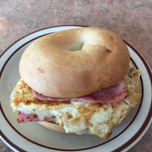 Best looking, tasting and priced breakfast sandwich around!  Egg, ham &amp; cheese on a toasted bagel cooked to order!