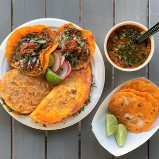 a plate of tortillas and a bowl of salsa