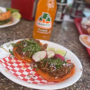 Birria tacos and jarritos