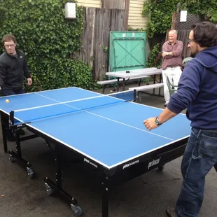 The ping pong table out back, with a couple of the regulars playing a game.