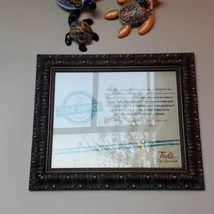 a framed picture of two turtles