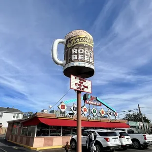 a large ice cream cone on a pole