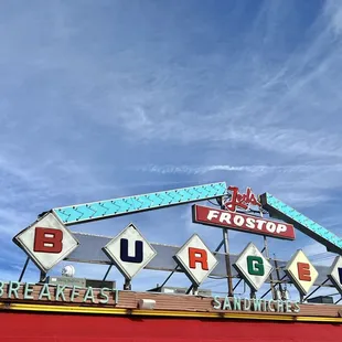 the neon sign for burgers