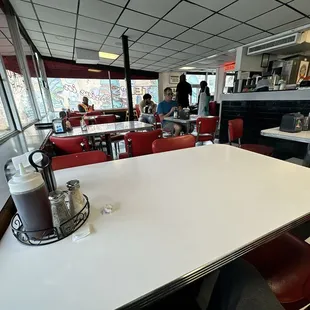 a table and chairs in a diner