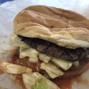 Char Burger has a lot of BBQ sauce on it