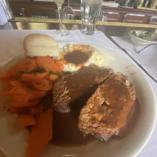 Meatloaf, mashed potatoes and gravy with glazed carrots and a hot roll.  Good!