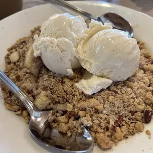 Apple  crisp a la mode with an extra scope of vanilla ice cream